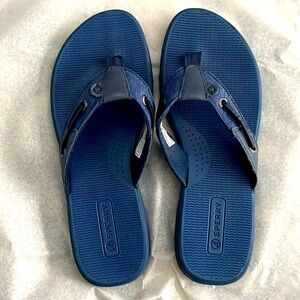 Flip flops in a bright navy blue color.